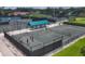 Community tennis courts with shade pavilions, showcasing a vibrant and active lifestyle at 7422 W Country Club N Dr, Sarasota, FL 34243