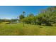 Expansive grassy backyard, pond views at 7822 Allen Robertson Pl, Sarasota, FL 34240