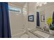 Clean bathroom with a shower/tub combo and granite countertop at 8669 Rain Song Rd, Sarasota, FL 34238