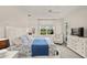 King-size bed, large window, and plenty of space in this main bedroom at 8669 Rain Song Rd, Sarasota, FL 34238