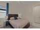 Charming bedroom with full-size bed and adjacent bathroom at 8669 Rain Song Rd, Sarasota, FL 34238