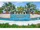 Sunrise Preserve community entrance with water feature at 8669 Rain Song Rd, Sarasota, FL 34238