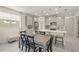 Kitchen features a dining area with a rustic wooden table and black chairs at 8669 Rain Song Rd, Sarasota, FL 34238