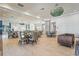 Bright dining area with tables and chairs in community at 8669 Rain Song Rd, Sarasota, FL 34238