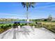 Enjoy grilling with lake views at this community's outdoor kitchen at 8669 Rain Song Rd, Sarasota, FL 34238