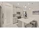 Modern kitchen with gray cabinets, white quartz countertops, and stainless steel appliances at 8669 Rain Song Rd, Sarasota, FL 34238