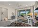 Light and airy living room with a comfortable sofa and a view of the backyard from sliding glass doors at 8669 Rain Song Rd, Sarasota, FL 34238