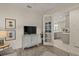 Bright living room with French doors opening to the kitchen at 8669 Rain Song Rd, Sarasota, FL 34238