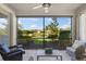 Spacious screened patio with comfortable seating and tranquil view at 8669 Rain Song Rd, Sarasota, FL 34238