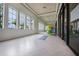 Tranquil yoga studio with herringbone floors and natural light at 8669 Rain Song Rd, Sarasota, FL 34238