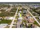 Aerial view showcasing a single-Gathering home with a pool in a residential neighborhood at 949 Chevy Chase St, Port Charlotte, FL 33948