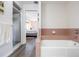 Bathroom with tub and shower, view of bedroom at 949 Chevy Chase St, Port Charlotte, FL 33948