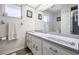 Clean bathroom with a vanity, toilet, shower, and large mirror at 949 Chevy Chase St, Port Charlotte, FL 33948