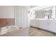 Bathroom with double vanity, tub, and separate shower at 949 Chevy Chase St, Port Charlotte, FL 33948