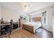 Cozy bedroom with a queen-size bed, built-in desk and home office space at 949 Chevy Chase St, Port Charlotte, FL 33948