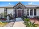 Welcoming front entry with decorative landscaping at 949 Chevy Chase St, Port Charlotte, FL 33948