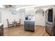 Updated kitchen with gray cabinets, stainless steel appliances and breakfast nook at 949 Chevy Chase St, Port Charlotte, FL 33948