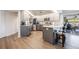 Modern kitchen with gray cabinets, stainless steel appliances, and an island at 949 Chevy Chase St, Port Charlotte, FL 33948
