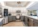 Modern kitchen with stainless steel appliances and gray cabinets at 949 Chevy Chase St, Port Charlotte, FL 33948
