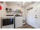 Laundry room with washer, dryer, and utility sink at 949 Chevy Chase St, Port Charlotte, FL 33948
