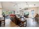Spacious living room with a fireplace, large TV, and comfy leather couches at 949 Chevy Chase St, Port Charlotte, FL 33948