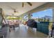 Relaxing screened porch with seating and grill at 949 Chevy Chase St, Port Charlotte, FL 33948