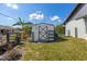 White storage shed in backyard at 949 Chevy Chase St, Port Charlotte, FL 33948