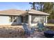 Home exterior showcasing a screened porch and patio at 9800 Horizon Dr, Spring Hill, FL 34608