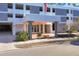 Welcoming entrance of The 101 Condominium, featuring a stylish canopy and well-maintained landscaping at 101 S Gulfstream Ave # 5K, Sarasota, FL 34236