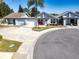 Wider aerial view showcasing multiple homes and landscape at 104 Carswell Cir # 10, Sun City Center, FL 33573