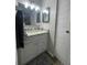 Clean bathroom, granite countertop, and white cabinets at 104 Carswell Cir # 10, Sun City Center, FL 33573