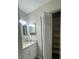 Updated bathroom with granite vanity and linen closet at 104 Carswell Cir # 10, Sun City Center, FL 33573