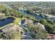 Aerial view of house and property, showcasing curb appeal and waterfront lot at 1060 Water Oak Ne Ct, St Petersburg, FL 33703