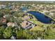 Bird's-eye view of a waterfront property with lush landscaping at 1060 Water Oak Ne Ct, St Petersburg, FL 33703