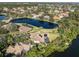 Property view showing house with pool and waterway at 1060 Water Oak Ne Ct, St Petersburg, FL 33703