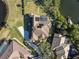 Bird's-eye view of home with solar panels near a lake at 1060 Water Oak Ne Ct, St Petersburg, FL 33703