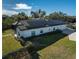 Solar panels on the roof of a house with a pool and fence at 1060 Water Oak Ne Ct, St Petersburg, FL 33703