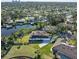 Aerial view of a waterfront home with solar panels and private dock at 1060 Water Oak Ne Ct, St Petersburg, FL 33703