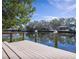 Wooden dock offering water access and scenic views at 1060 Water Oak Ne Ct, St Petersburg, FL 33703