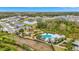 A beautiful aerial view of a community playground, pool and common areas at 11630 Woodleaf Dr, Bradenton, FL 34211