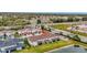 Aerial view of townhome community near a lake, showing the property's proximity to main roads at 11630 Woodleaf Dr, Bradenton, FL 34211