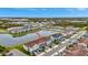 Aerial view of townhome community, showing the property's location and access to a lake at 11630 Woodleaf Dr, Bradenton, FL 34211