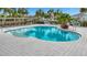 Inviting community pool with ample seating at 11630 Woodleaf Dr, Bradenton, FL 34211