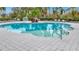 Relaxing community pool with lounge chairs at 11630 Woodleaf Dr, Bradenton, FL 34211