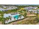 Aerial view of community pool, playground, and homes at 11630 Woodleaf Dr, Bradenton, FL 34211