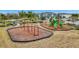 Community playground with swings and play structures at 11630 Woodleaf Dr, Bradenton, FL 34211