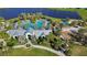 Gorgeous aerial view of the community clubhouse, pool and playground area by the lake at 11794 Little River Way, Parrish, FL 34219