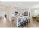 Bright, spacious kitchen featuring a center island, stainless steel appliances, and an adjacent dining area at 11794 Little River Way, Parrish, FL 34219