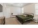 Neutral colored main bedroom features lots of light, carpeted floors and a tray ceiling at 11794 Little River Way, Parrish, FL 34219