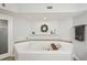 Spa-like bathroom with corner jacuzzi tub and updated fixtures at 120 Tidy Island Blvd # 120, Bradenton, FL 34210